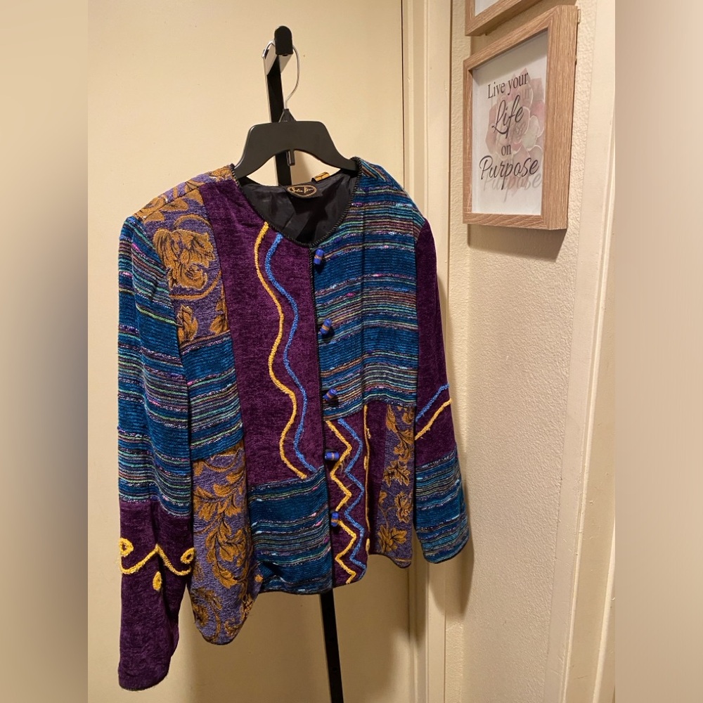 Multi color jacket with stone buttons.